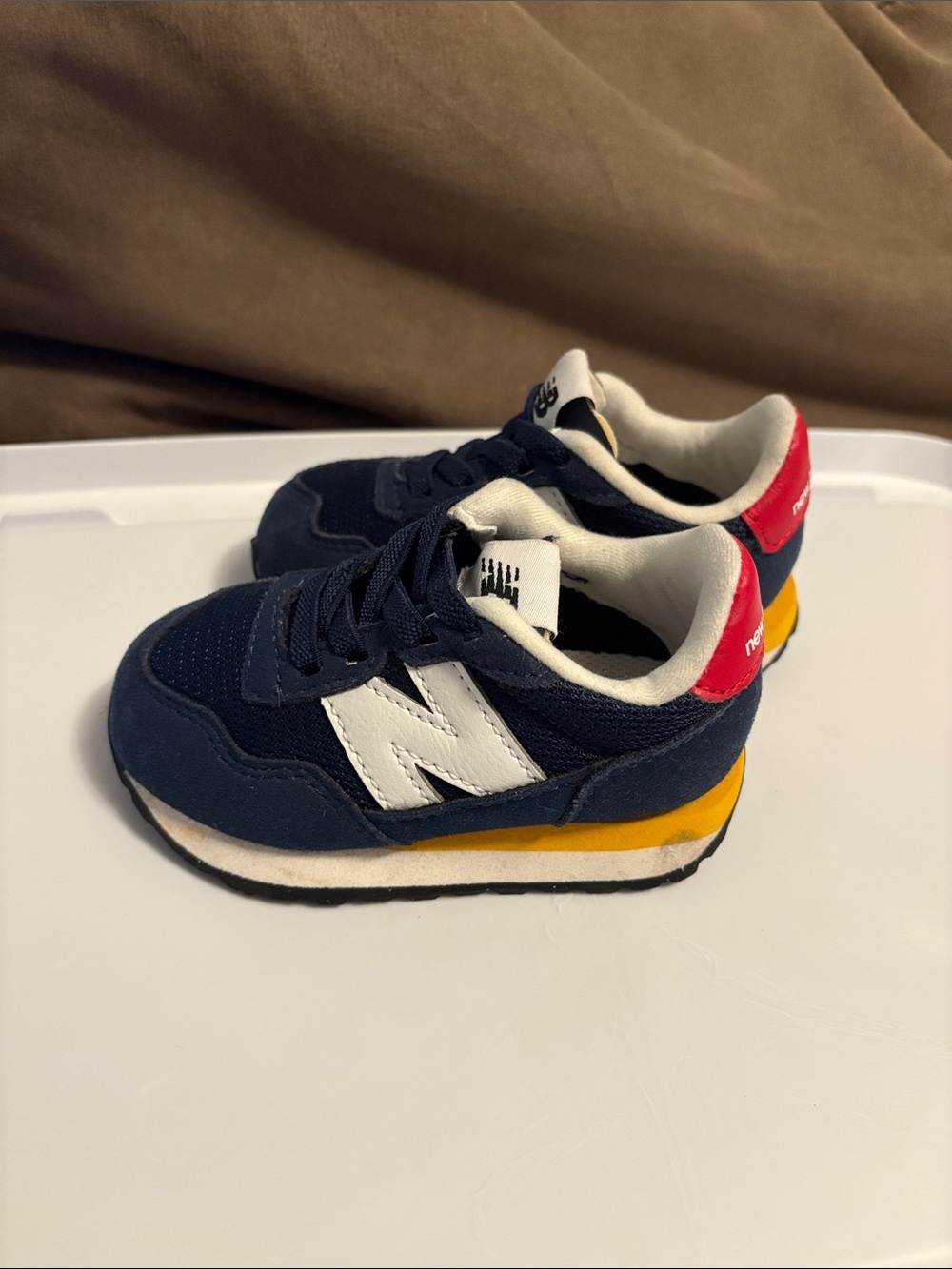 New Balance Navy, White & Yellow Kids Sneakers with Red Heel